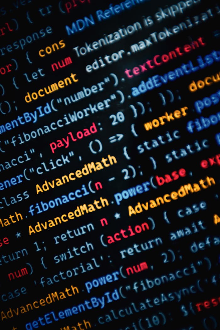 Close-up of vibrant JavaScript code displayed on a monitor showcasing web development.